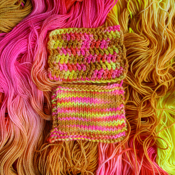 Crochet and knit swatches colored a bright yellow, pink, and a salmon pink orange, also a yellow beige color. These swatches are on top of unwound skeins of this colorway.